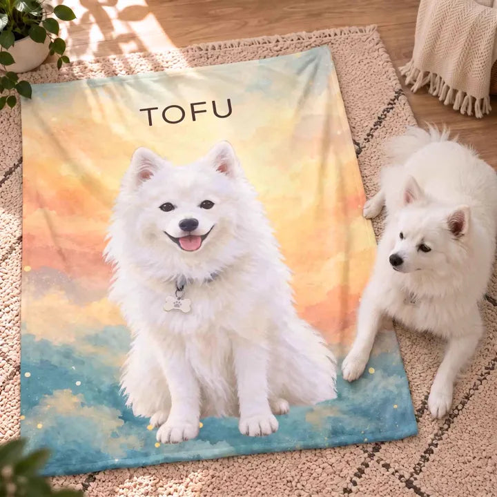 Tofu the Samoyed painted on a Dream custom pet photo blanket, laid flat on a sunlit rug beside a real Samoyed